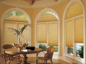 interior photo of specialty shape blinds in a dining room